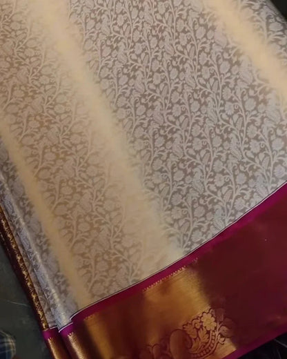 Textured fabric with a floral pattern and a red border