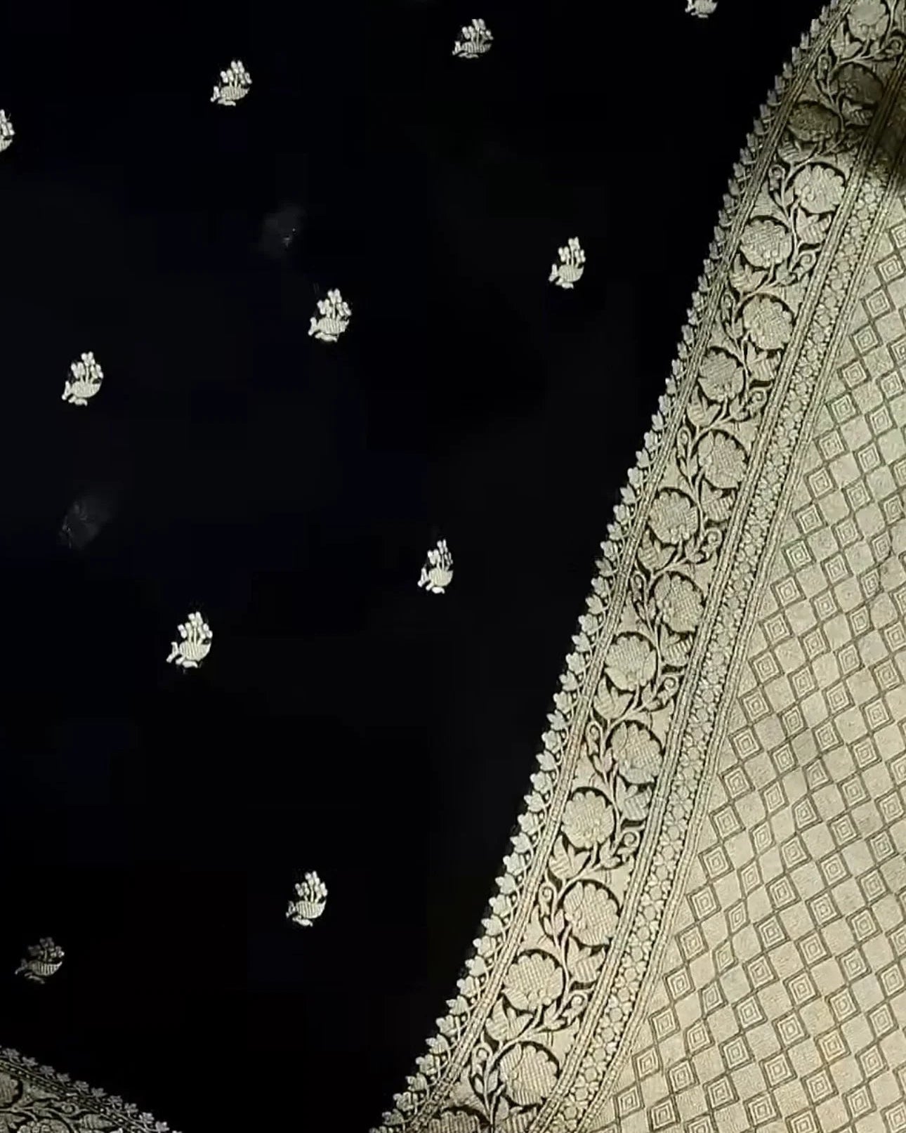 Close-up of a black and white patterned fabric with intricate designs.