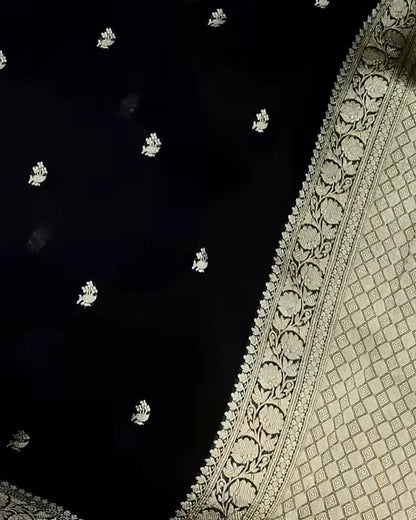 Close-up of a black and white patterned fabric with intricate designs.