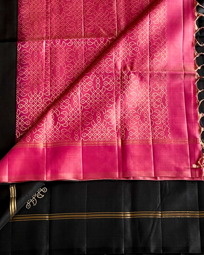 Black and pink saree with intricate patterns