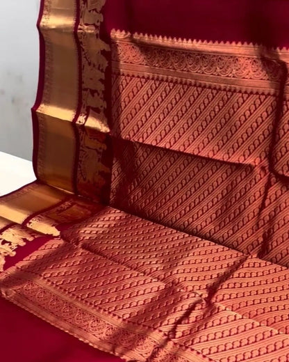 Red fabric with intricate gold patterns