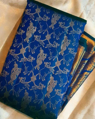Blue fabric with intricate gold patterns on a beige background