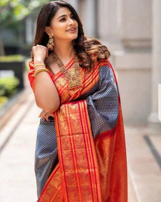 Woman in a traditional saree with a blurred outdoor background